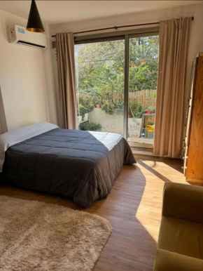 Apartment with balcony, garden and parrilla